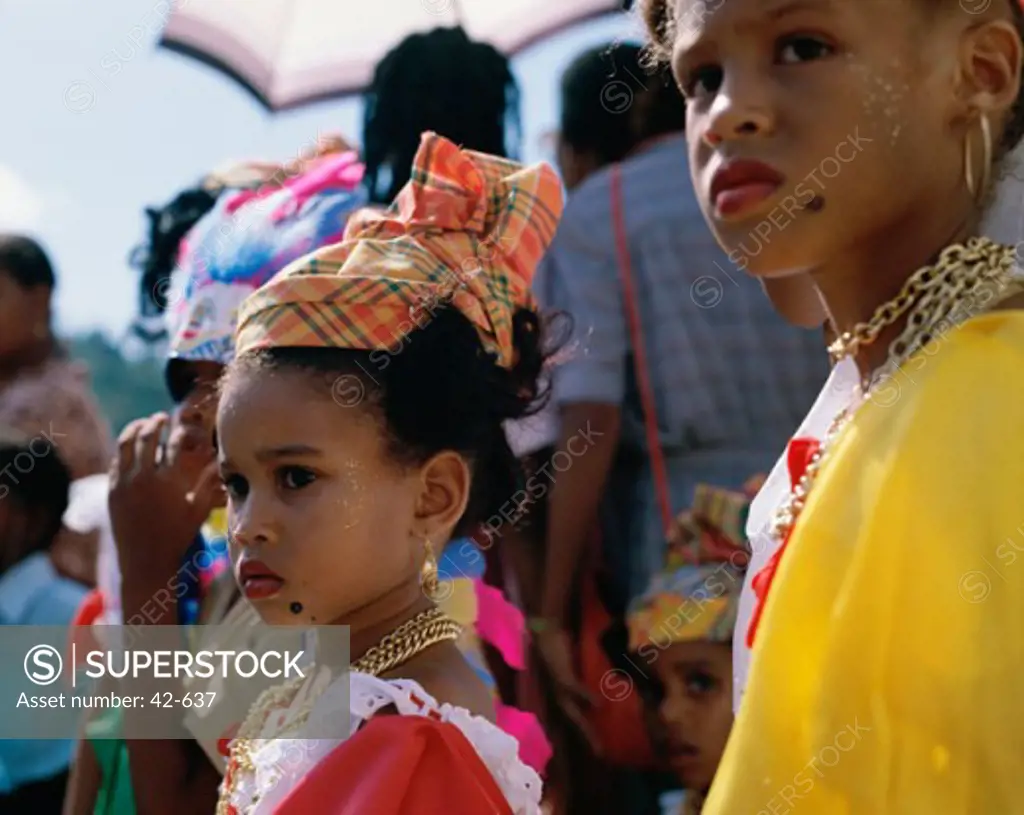Side profile of two girls dressed in traditional costume, Martinique