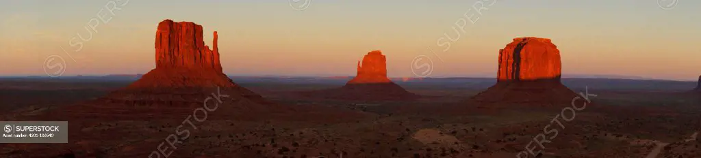 Mittens being illuminated by light, Monument Valley Navajo Tribal Park, Arizona