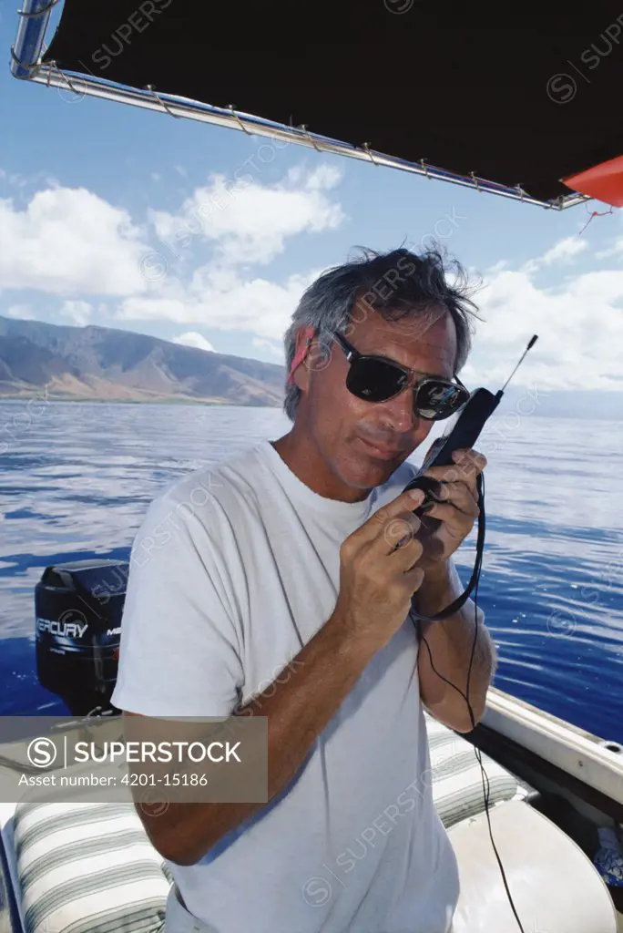 Humpback Whale (Megaptera novaeangliae) researcher Dr James Darling listening to whales, Hawaii