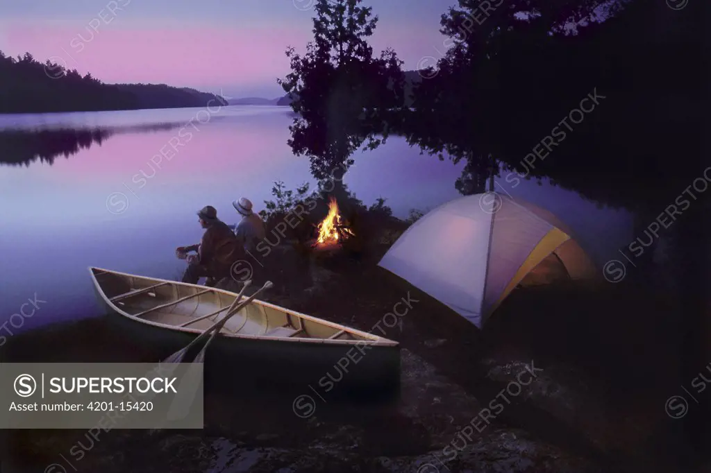 Campers watching sunset, Quetico Provencial Park, Canada