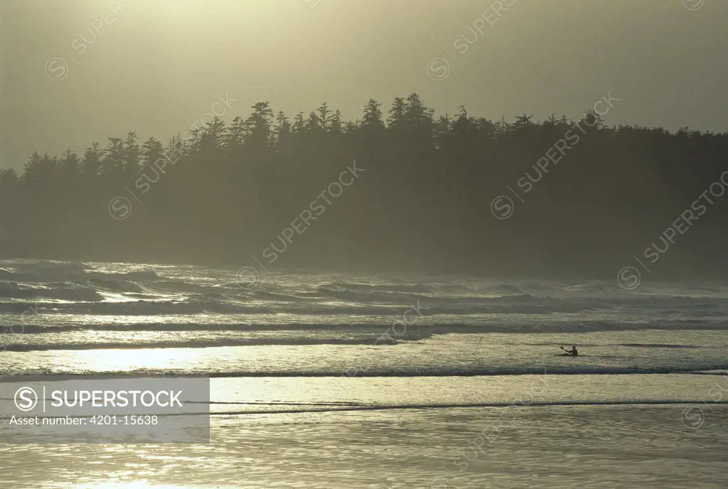 Kayaker in surf along Long Beach, Clayoquot Sound, Vancouver Island, British Columbia, Canada