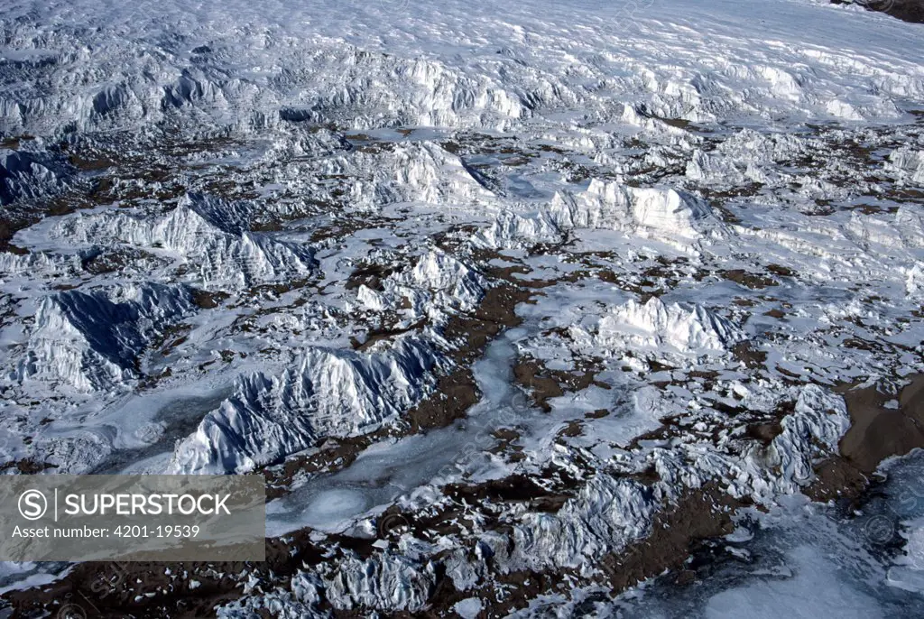 Aerial view of windswept ice formations at the base of a glacier in the McMurdo dry valleys, Victoria Land, Antarctica