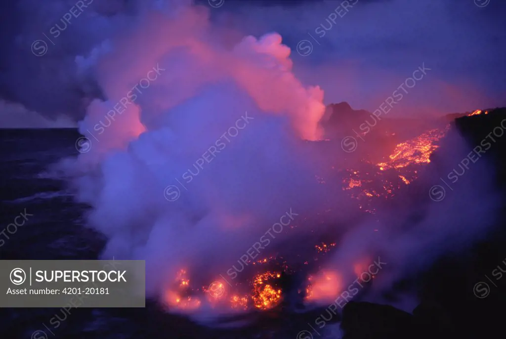 An a'a lava flow entering the sea along a steep shoreline with resulting steam plumes, Cape Hammond, Fernandina Island, Galapagos Islands, Ecuador