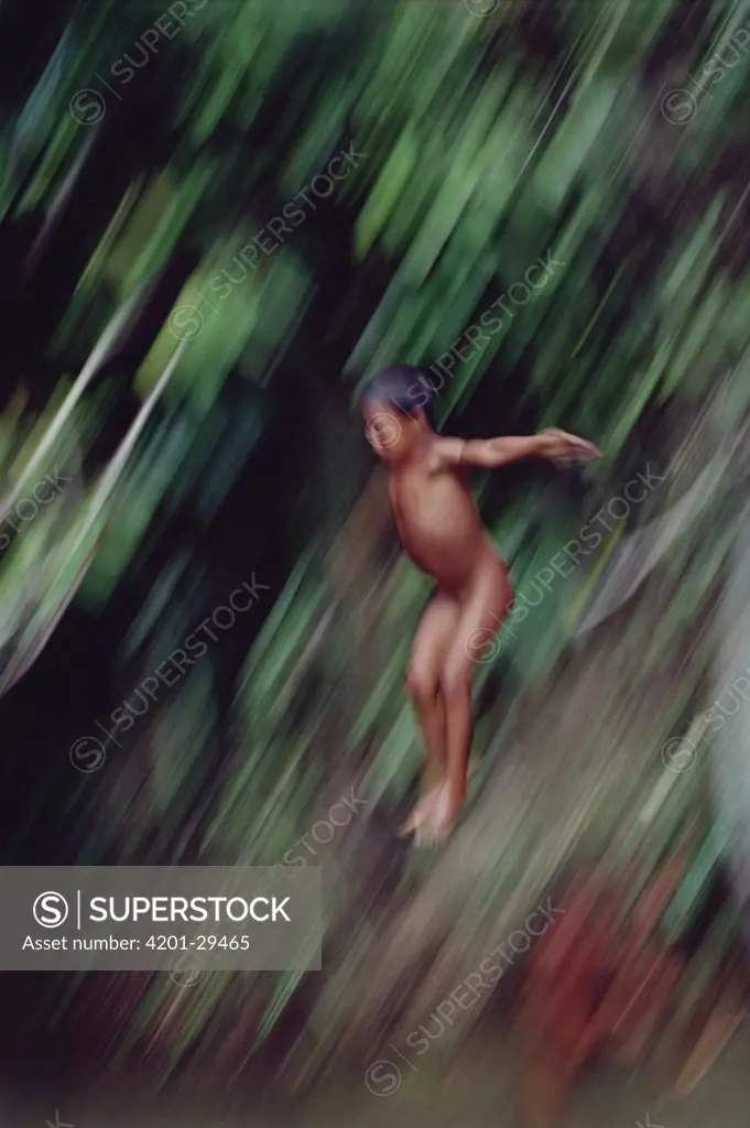 Ianomami child diving, Amazon ecosystem, Brazil