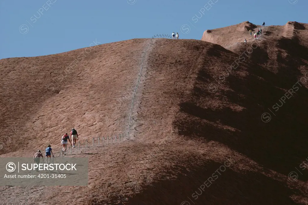 Tourists hiking on Ayers Rock, Uluru-Kata Tjuta National Park, Northern Territory, Australia