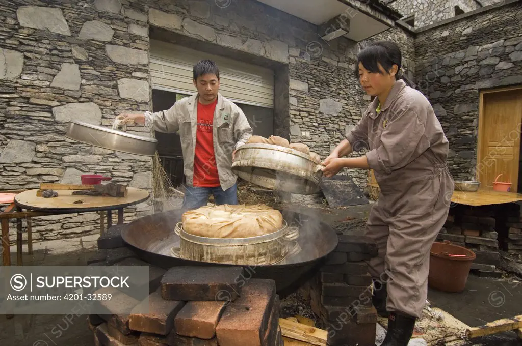 Workers making bamboo bread for pandas after the May 12, 2008 earthquake and landslides, CCRCGP, Wolong, China