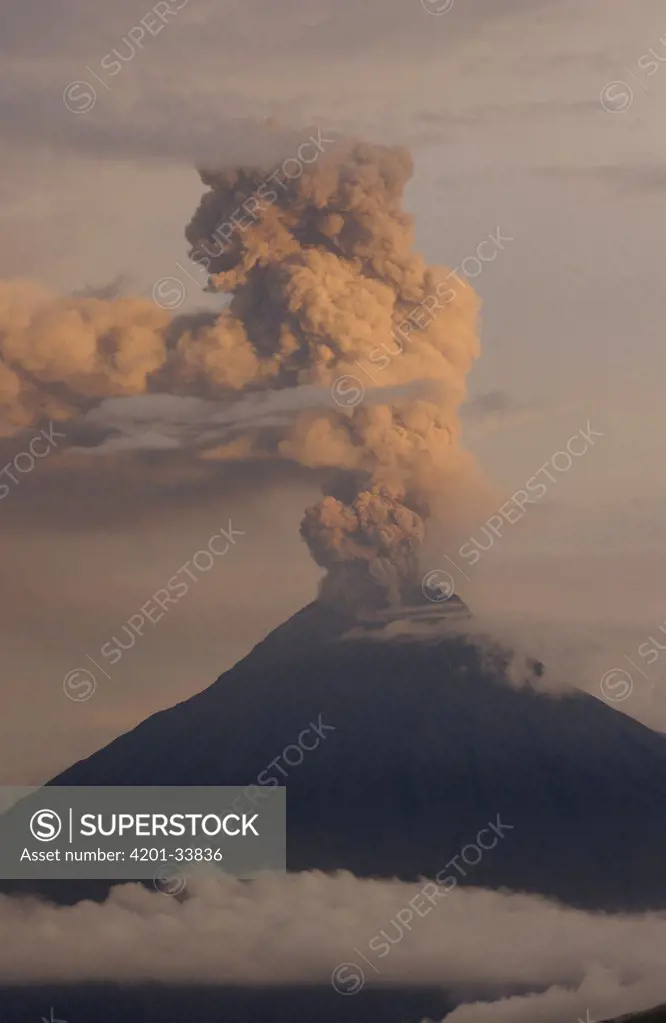 Tungurahua volcano erupting, at 5,023 meters this active stratovolcano causes frequent tremors in the neighboring city of Banos, among the Andes Mountains, Ecuador