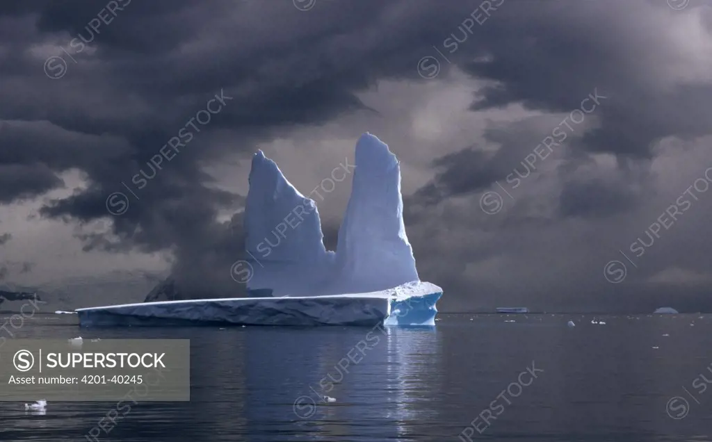 Iceberg against stormy sky, Antarctica