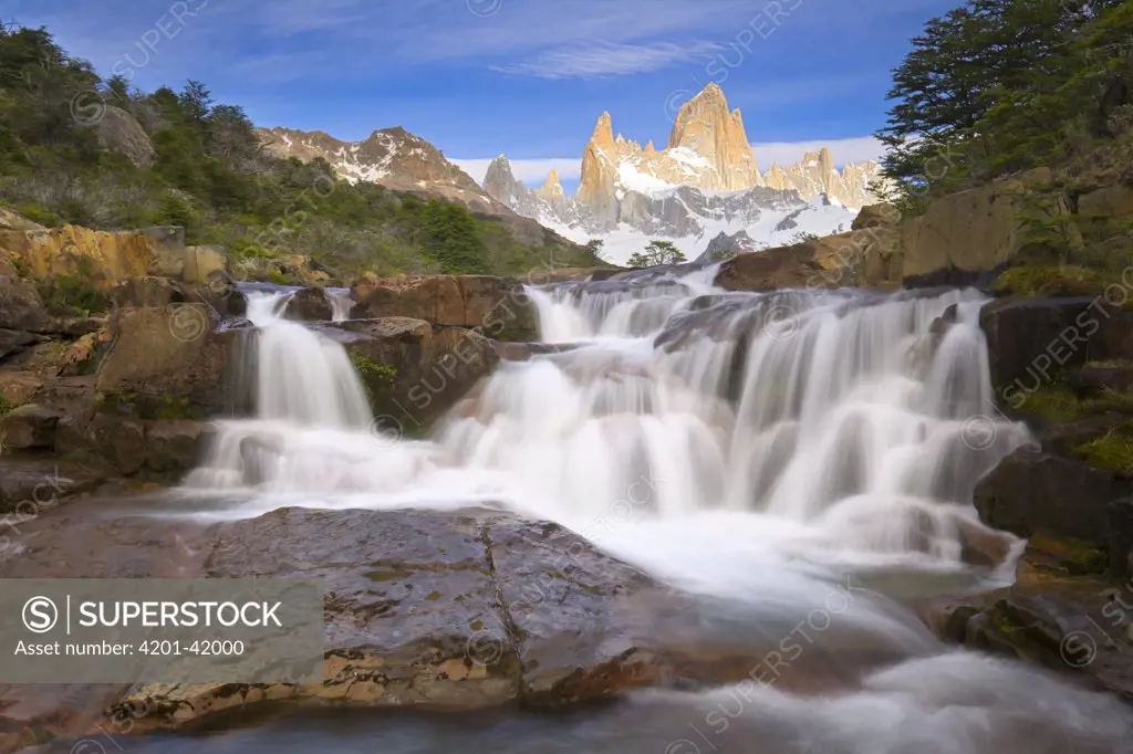 Waterfalls of river flowing from glaciers and snow fields of Fitzroy Massif cascading over rocks, Andes, Los Glaciares National Park, Patagonia, Argentina
