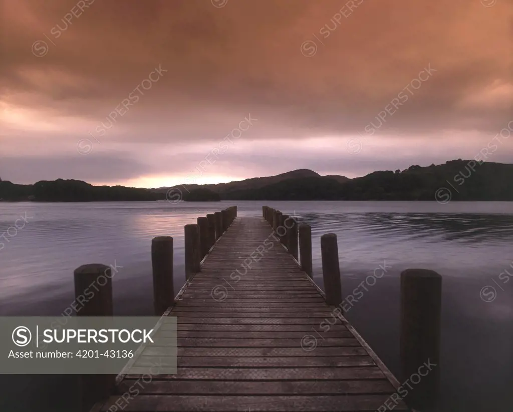 Jetty and lake at sunset, Coniston Water, Cumbria, England