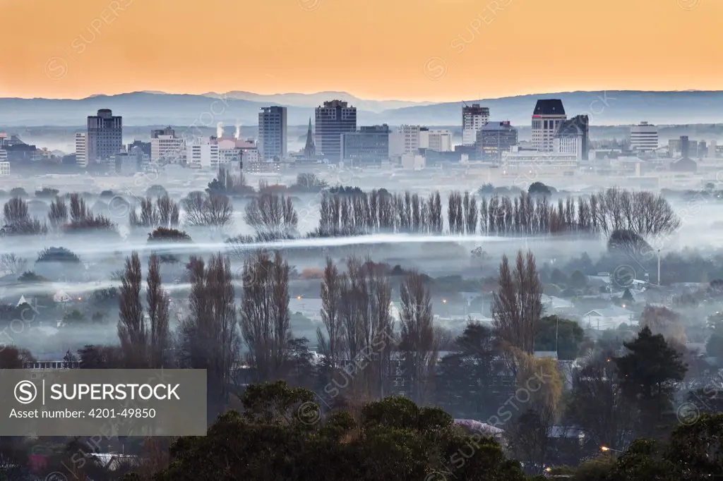 Smog and smoke from wood and coal fires at dawn blankets central city, Christchurch, Canterbury, New Zealand