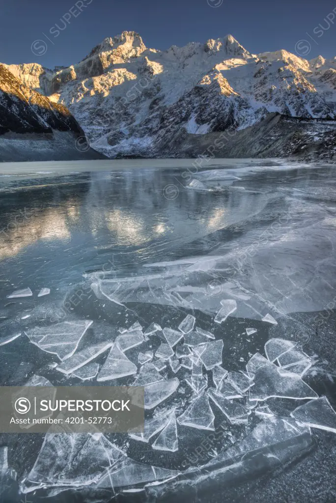 Mount Sefton reflected in frozen lake, Mueller Glacier, Mount Cook National Park, New Zealand