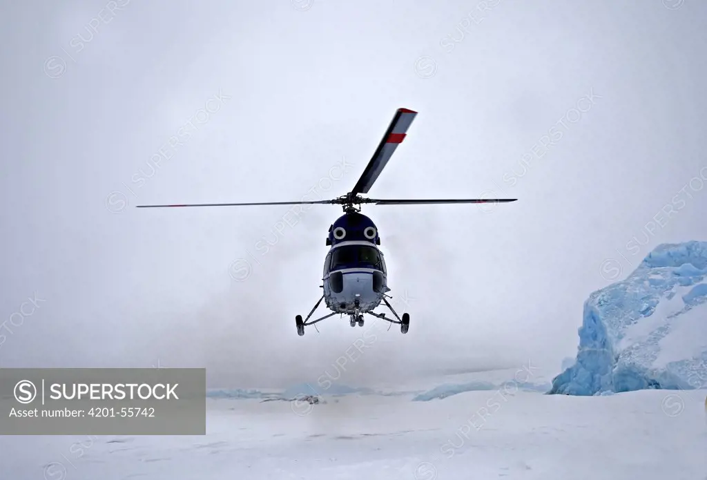 Helicopter of the Russian icebreaker Kapitan Khlebnikov landing on the ice, Antarctica