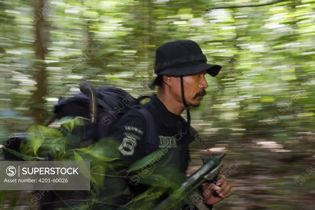 Rhino protection unit personnel patrolling in Way Kambas National Park, Sumatra, Indonesia