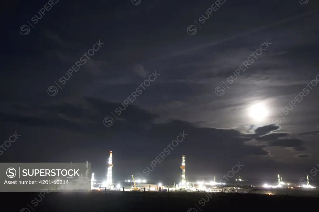 Natural gas drill platform with moon rising, Pinedale, Wyoming