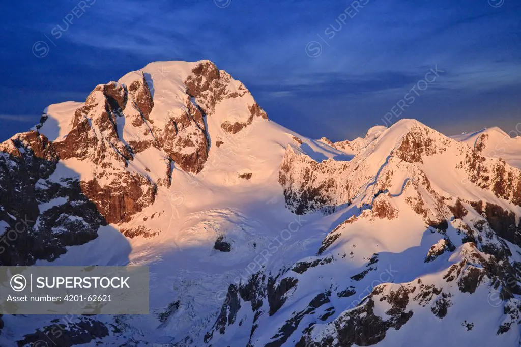 Mount Tutoko at dawn, 2723 metres, is the highest peak in Darran Mountains, Hollyford Valley, Fiordland National Park, New Zealand