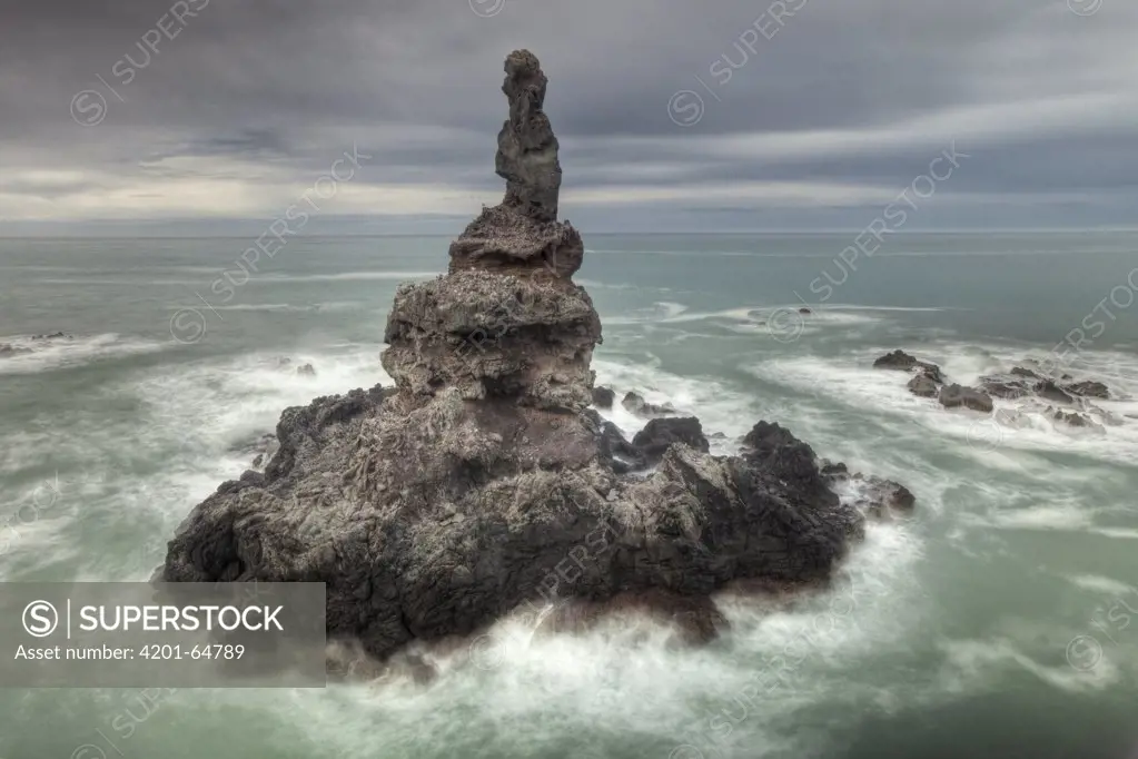 Sea stack off Tumbledown Bay, eastern bays of Banks Peninsula, Canterbury, New Zealand