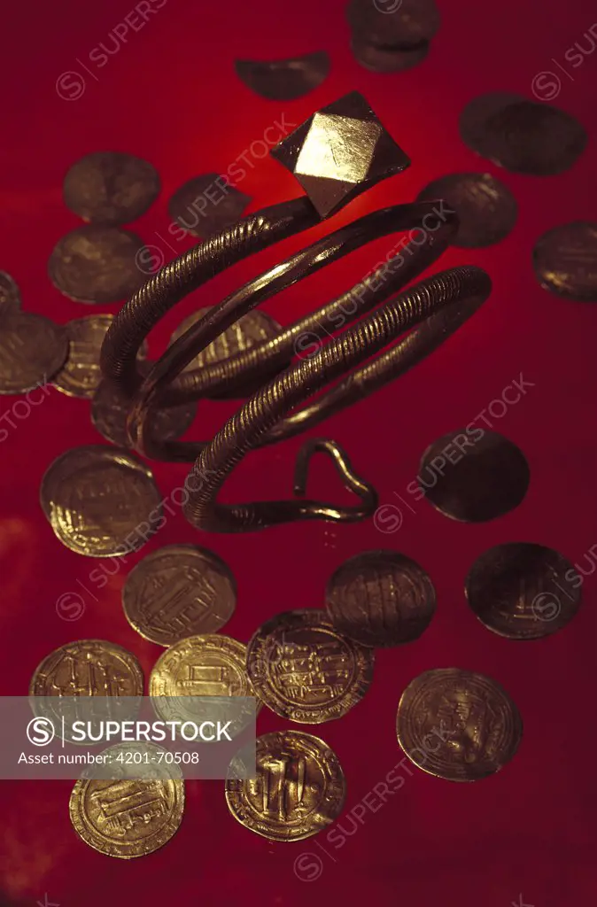 Coins and a bracelet made of Arabic silver that Vikings obtained through trade in what was formerly the Soviet Union, Russia