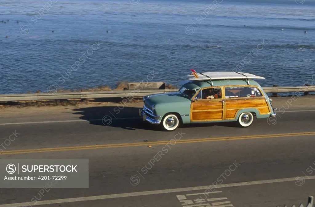 Pleasure Point surf check in a 1950 Ford Woodie owned by Jim Cocores, Santa Cruz, California