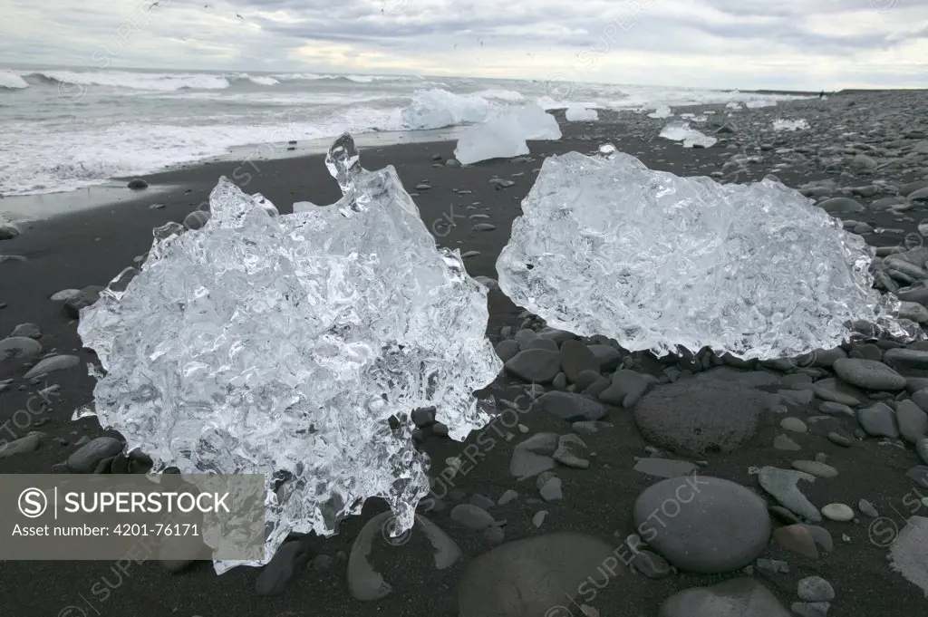 Ice from Vatnajokull Glacier on a volcanic black sand beach, Iceland