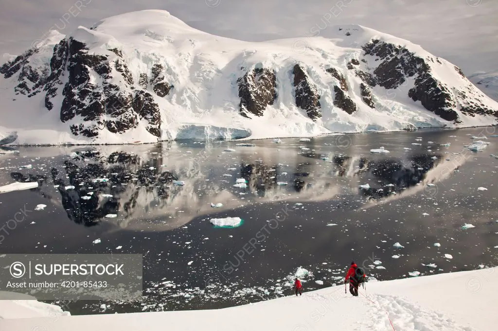 Climbers descend Peon Peak, Ronge Island, Antarctic Peninsula, Antarctica