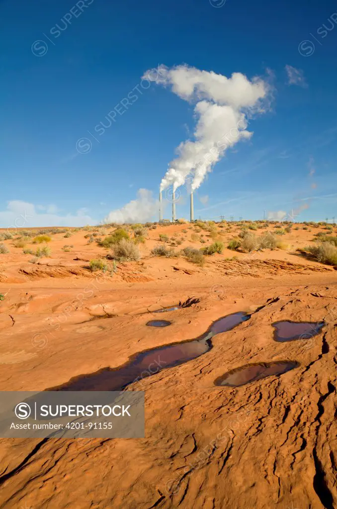 Power station with steam rising from its stacks over desert, Page, Arizona