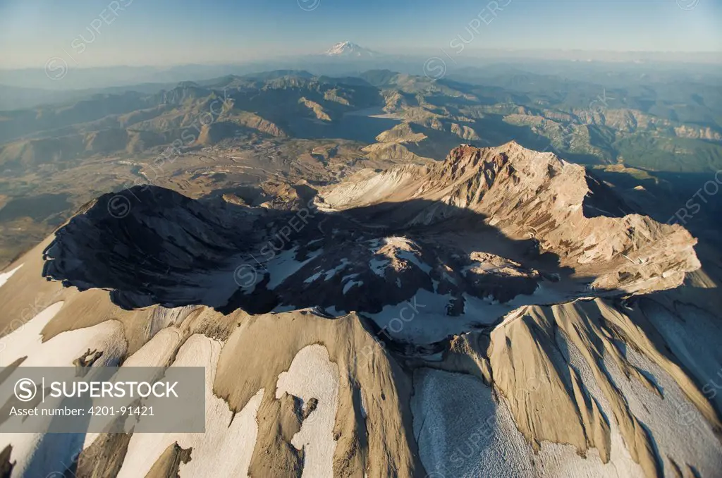 Aerial view of Mount St Helens crater with Mount Rainier behind, Mount St Helens National Volcanic Monument, Washington