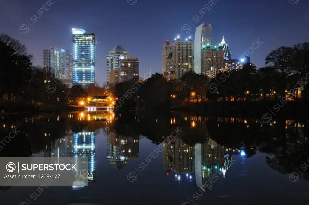Buildings lit up at the waterfront, Piedmont Park, Atlanta, Georgia, USA