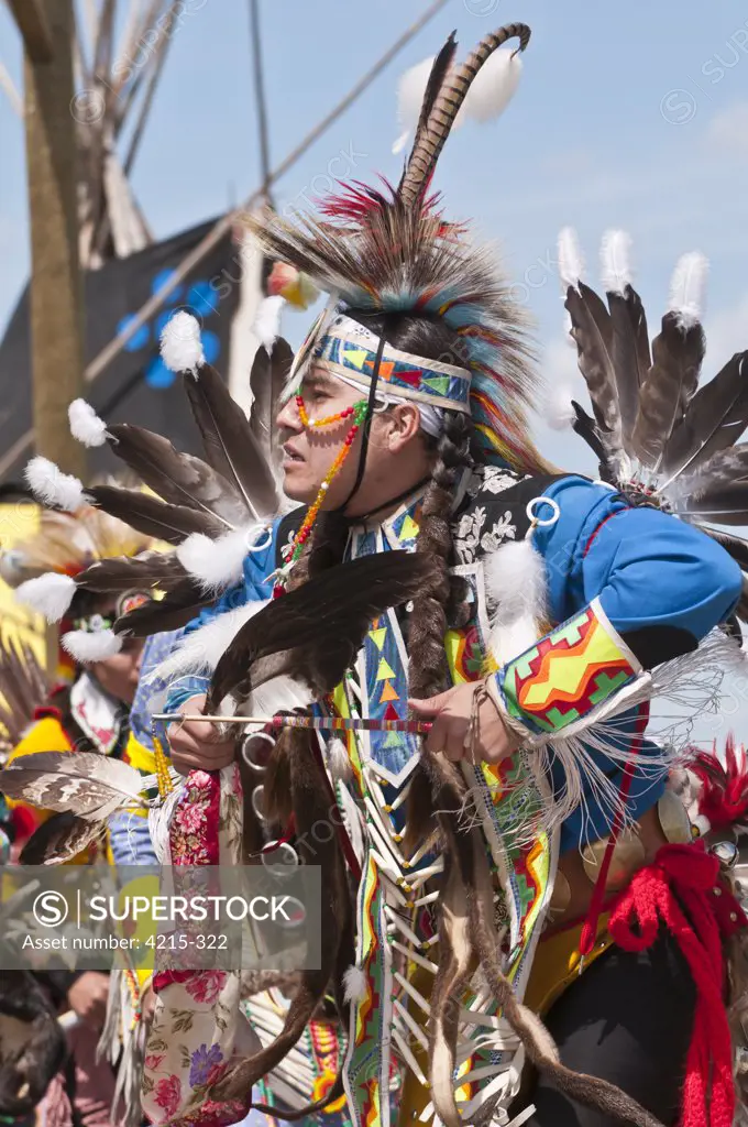 Young male dancer in traditional regalia in 2nd Annual World Chicken Dance Championships, Blackfoot Crossing Historical Park, Alberta, Canada