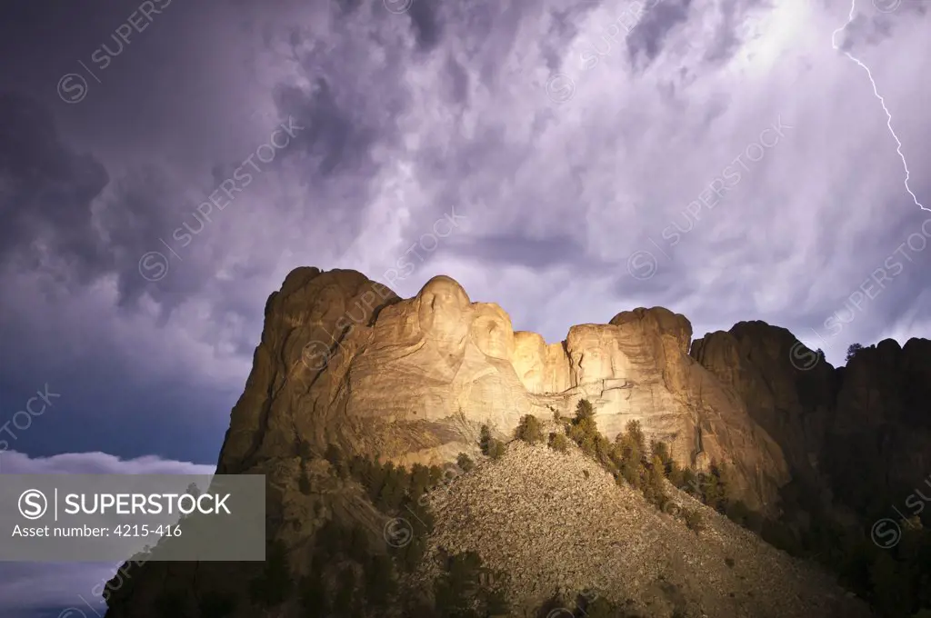 Storm clouds over Mt Rushmore National Monument at night, South Dakota, USA