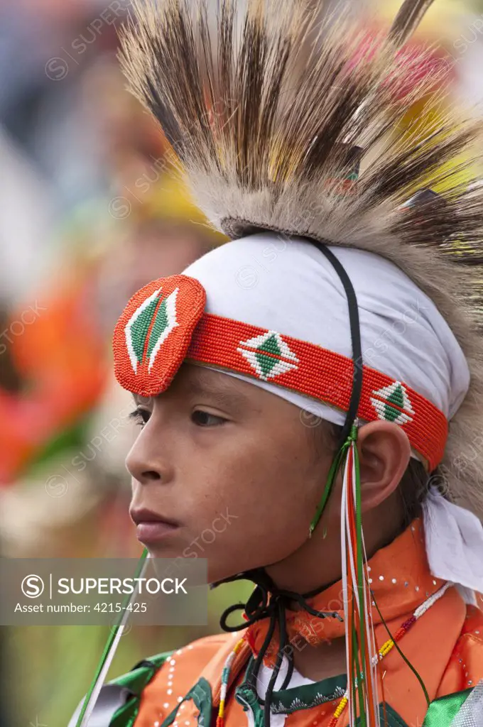 Boy in traditional regalia in Tsuu T'ina Pow-wow, Bragg Creek, Alberta, Canada