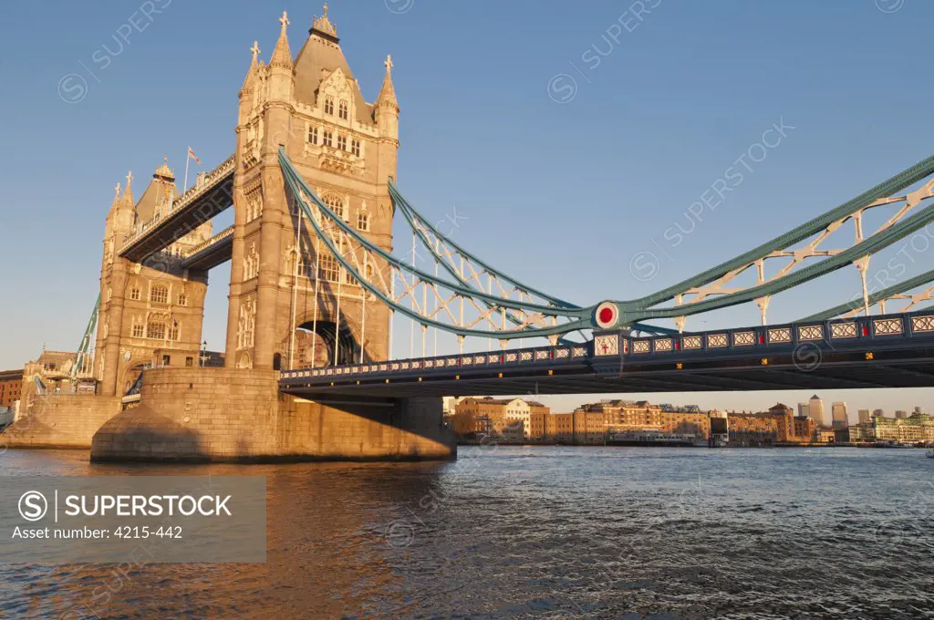 Tower Bridge across the Thames River at sunset, London, England