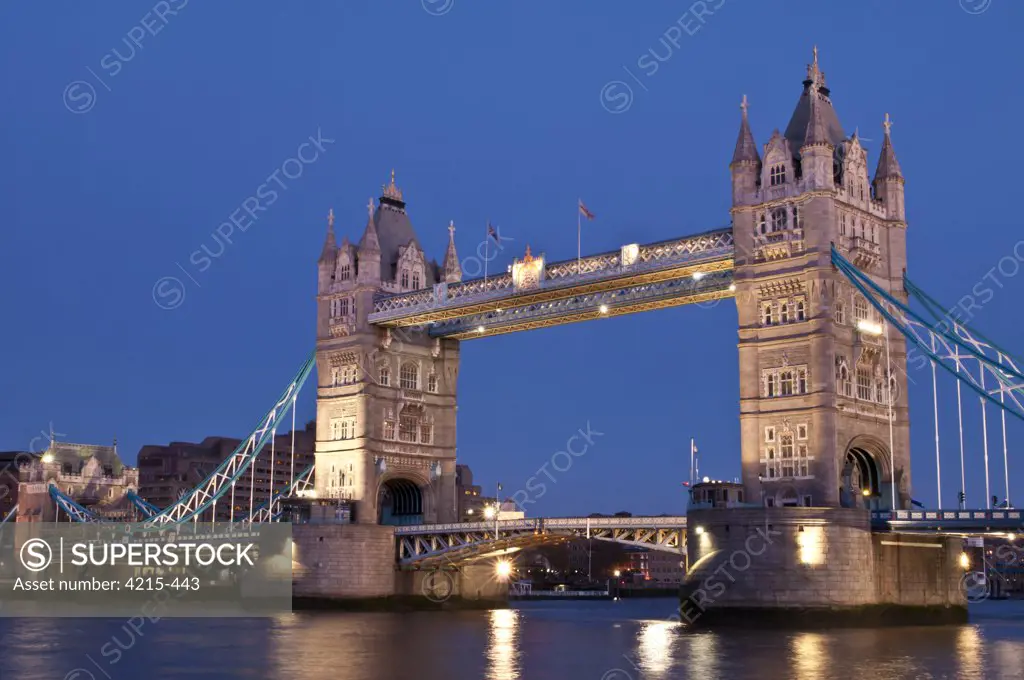 Tower Bridge across the Thames River at night, London, England