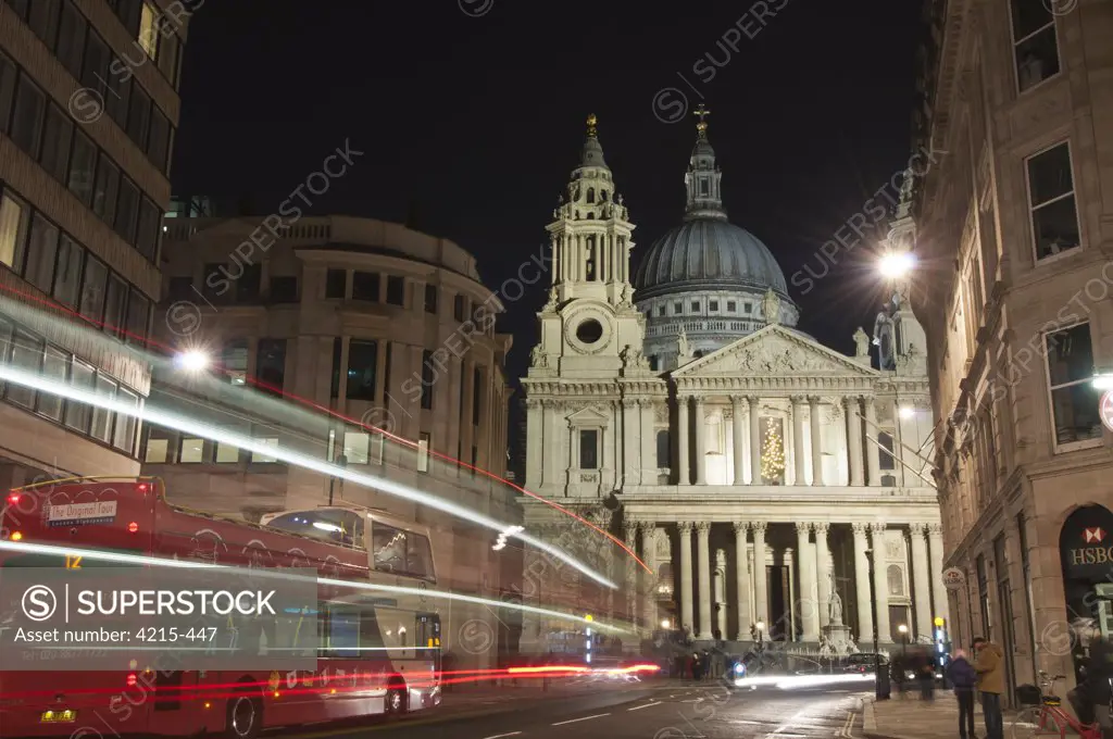Streaks of lights of moving vehicles in front of the St. Paul's Cathedral at night, City Of London, London, England