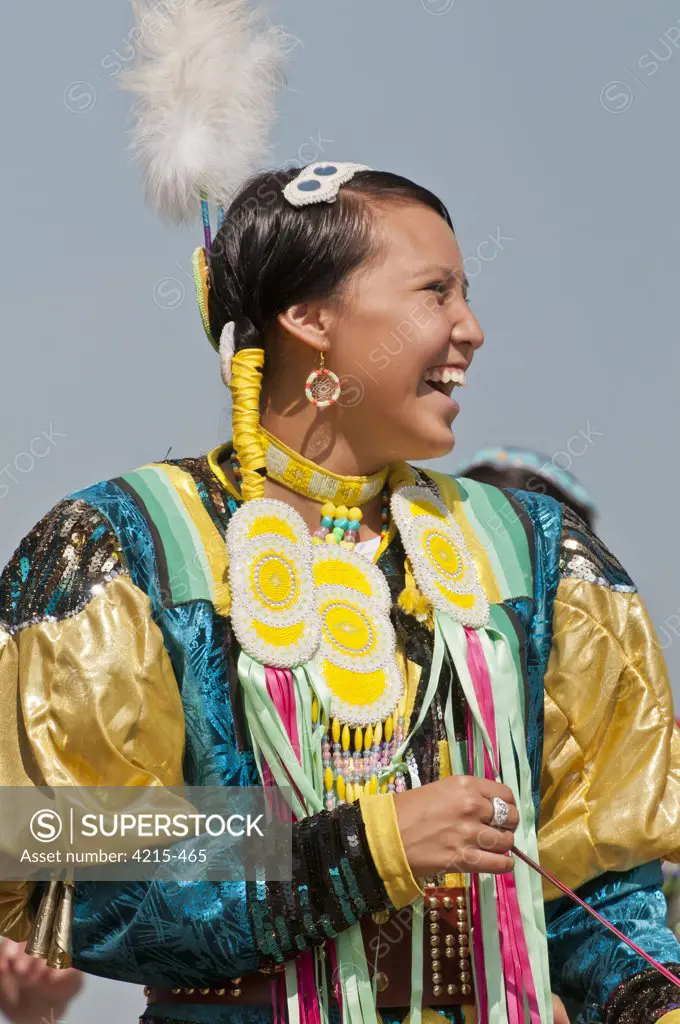 Female dancer in jingle dance regalia at powwow, Blackfoot Crossing Historical Park, Alberta, Canada