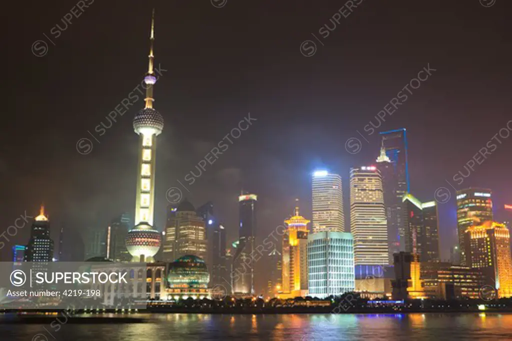 City lit up at night, Oriental Pearl Tower, The Bund, Pudong, Huangpu River, Shanghai, China