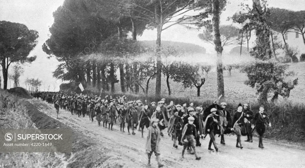 Blackshirted Fascists march  along the Via di Monterotondo  to  Rome : when they get  there, to avoid civil war,  Vittorio Emanuele will appoint  Mussolini prime minister.
