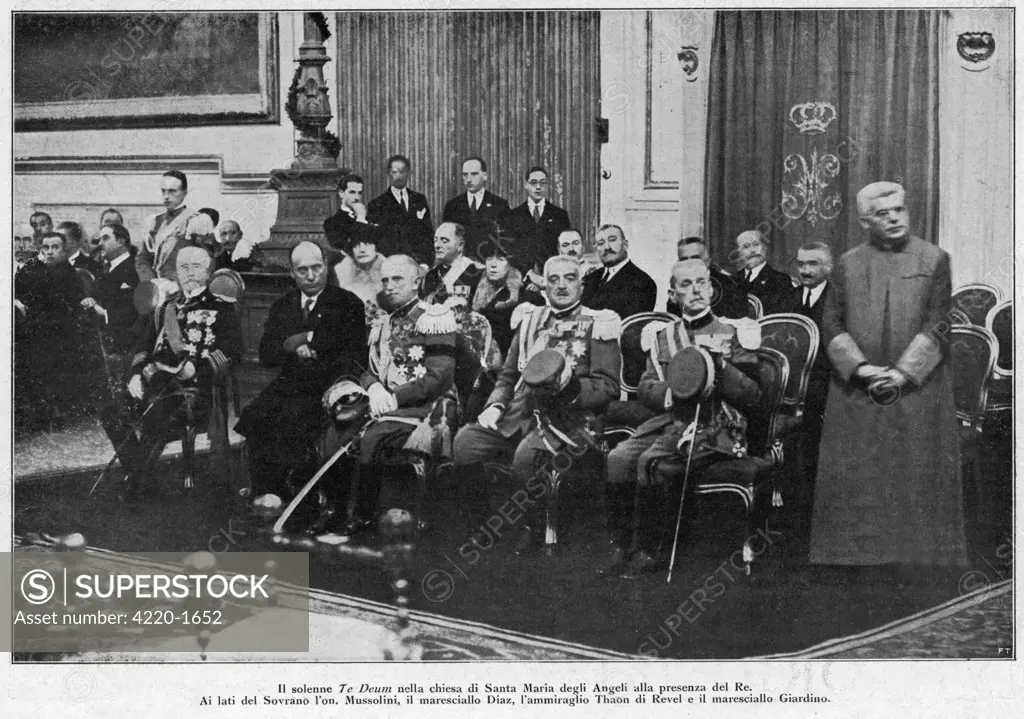 At a solemn Te Deum in the  church of Santa Maria degli  Angeli at Rome, Mussolini is  seated next to king Vittorio  Emanuele III.