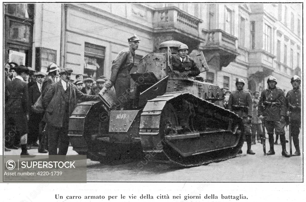 A tank makes a show of force  in the streets of Warsaw as  Piludski's supporters overcome  all resistance.