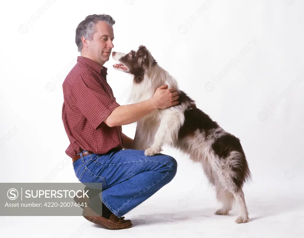 DOG - owner showing dog affection 