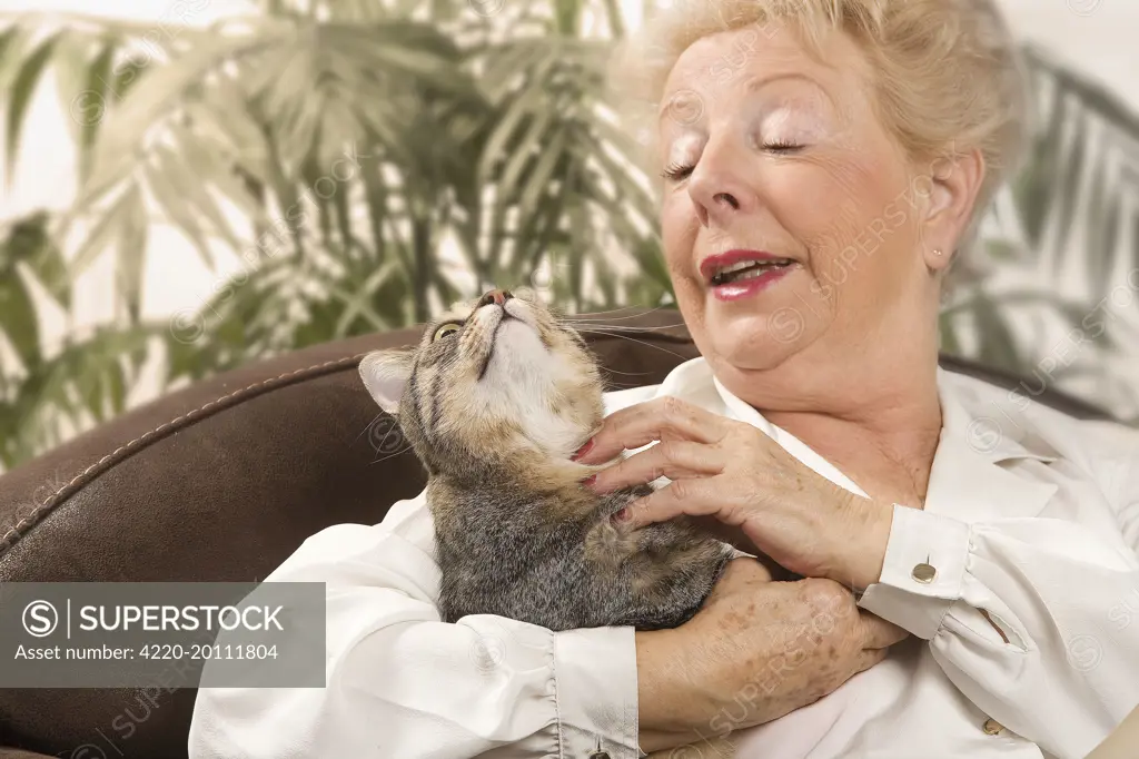Woman - cuddling tabby cat 