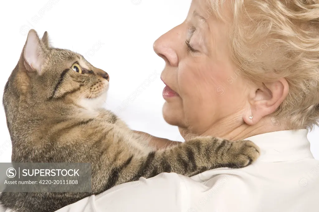 Woman - cuddling tabby cat 
