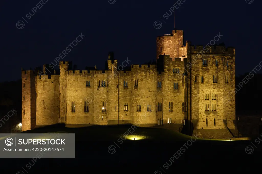 Alnwick Castle - illuminated at night-time. Northumberland UK.