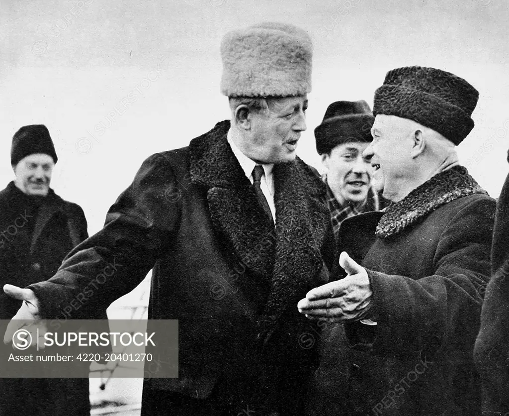 Harold Macmillan (1894-1986) (left), the first British Prime Minister to visit Soviet Russia in peacetime, is greeted by Nikita Khrushchev (1894-1971) (right), the leader of the Soviet Union at Moscow Airport,      Date: 21st February 1959