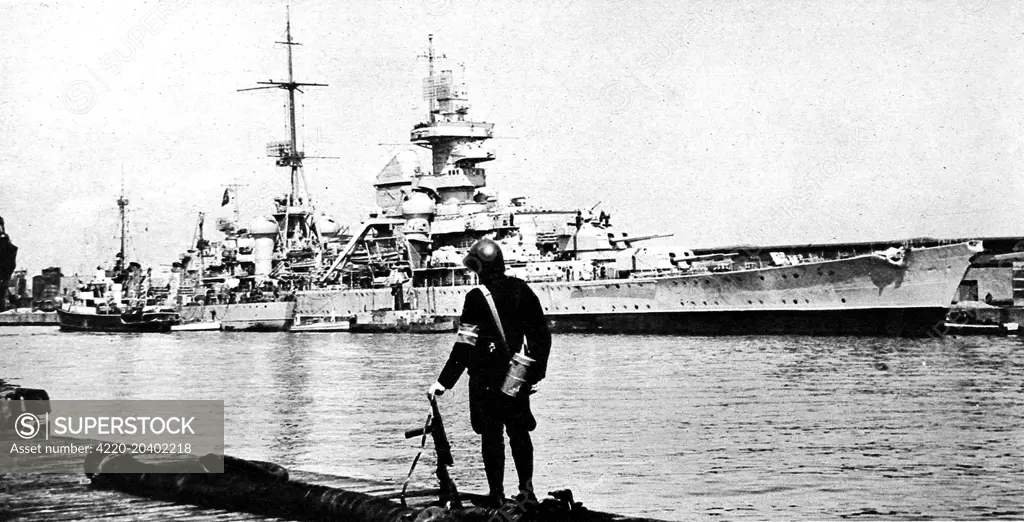 Photograph showing the German cruiser 'Prinz Eugen' under Danish guard, in Copenhagen harbour, after she had surrendered to the Royal Navy on 9th May 1945.     Date: 1945