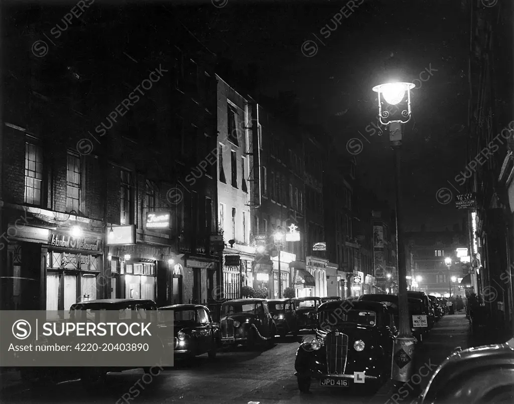 Photograph showing Frith Street, in Soho, by night c.1955.     Date: c.1955