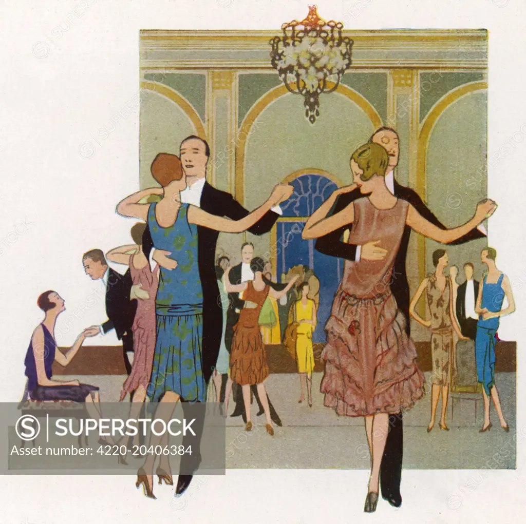 Elegantly dressed people dancing.  1927