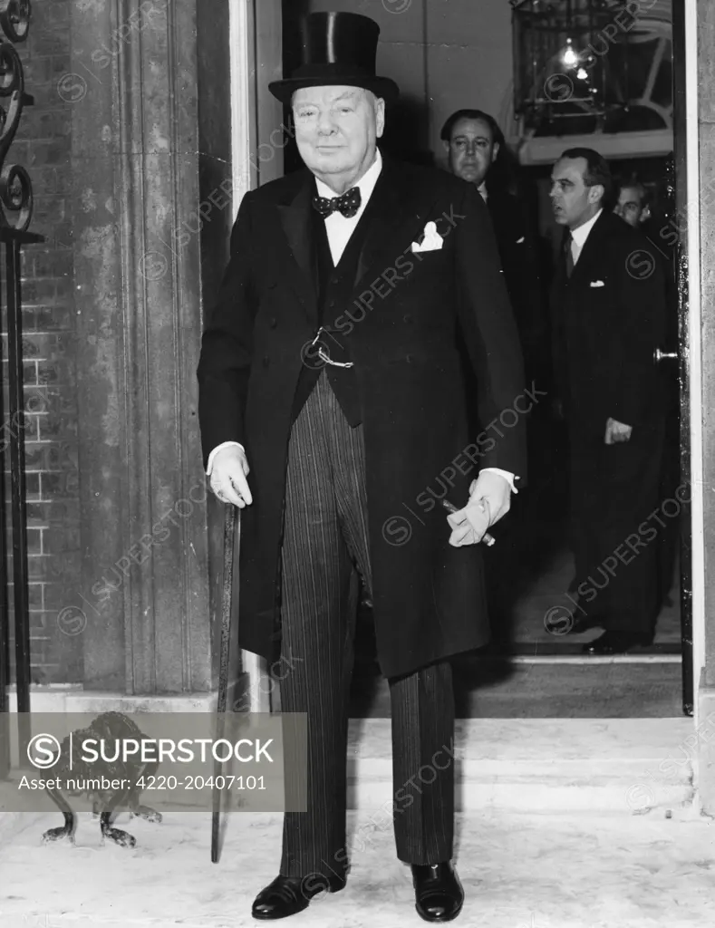  Sir Winston Leonard Spencer Churchill 1874 1965 British politician and Prime Minister on the steps of 10 Downing Street, London wearing a top hat as he prepares to leave for Buckingham Palace to tender his resignation     Date: 5th April 1955