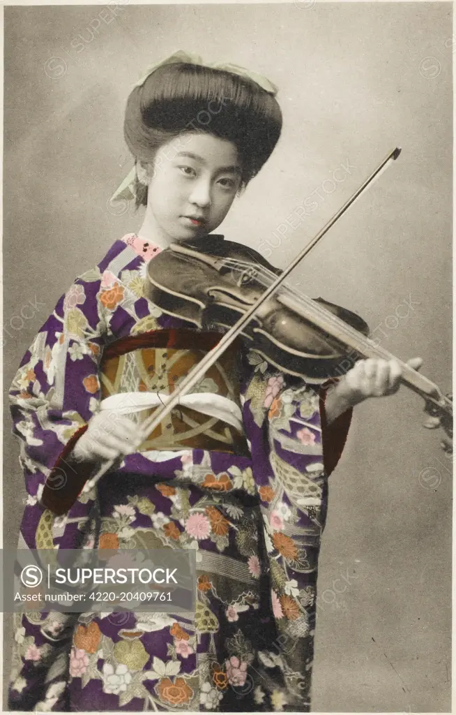 A stunning photographic postcard depicting a young Japanese girl playing the voilin.     Date: 1915