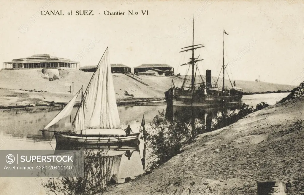 A fine view of the Suez canal, showing the old and the new; a large transport steamship and a traditional small sailing boat.     Date: circa 1910s